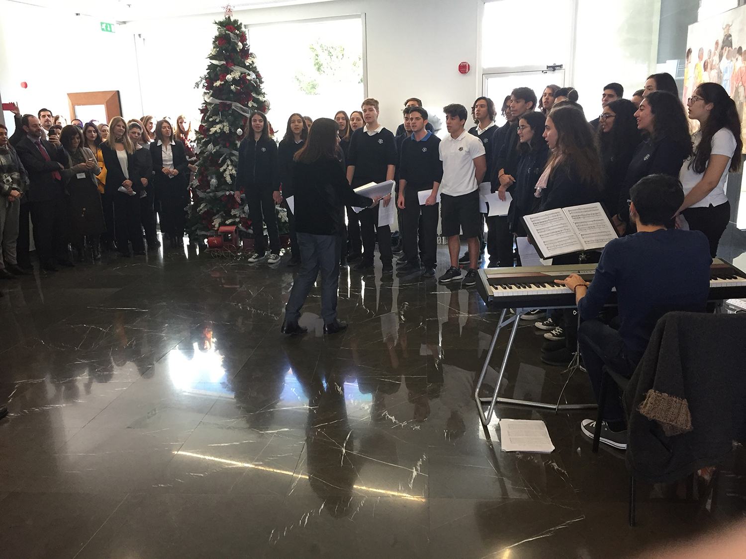 Christmas melodies from the English School choir, at CNP CYPRUS headquarters